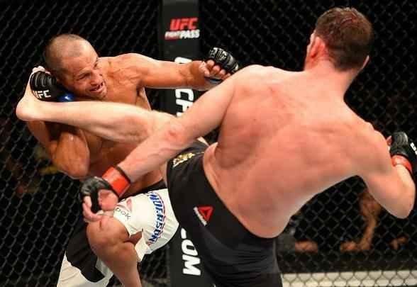 Na luta principal do UFC 204, em Manchester, Michael Bisping supera Dan Henderson em polêmica decisão unânime dos juízes e tem sucesso na primeira defesa de cinturão do peso médio