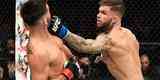 Cody Garbrandt (luvas azuis) venceu Dominick Cruz por deciso unnime e conquistou o cinturo dos galos